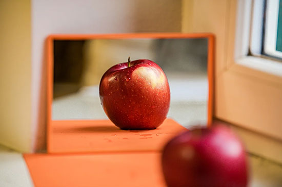 Apple in mirror When we shop for produce, we tend to look for defects. But when we build human connections, we should intentionally look for the good qualities in others.
