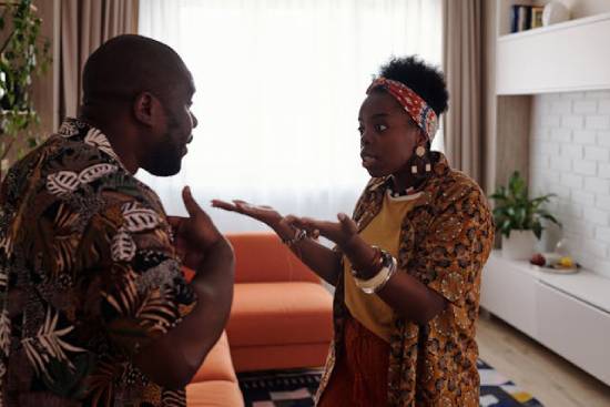 A Couple in a tense interaction A couple with frustrated faces having a tense interaction