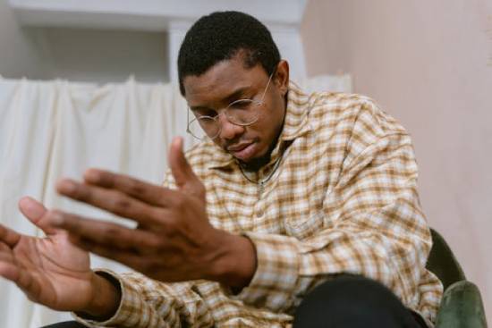 A Man Praying Image A man praying with open hands, illustrating how we can seek God for guidance for the future.