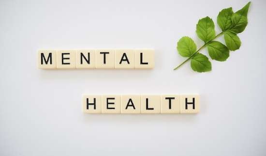 mental health stick A sign spelling 'Mental Health.'