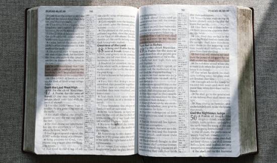 Open Bible with Highlighted Verses An open Bible with highlighted verses illustrates how God's promises can mean a lot to someone.