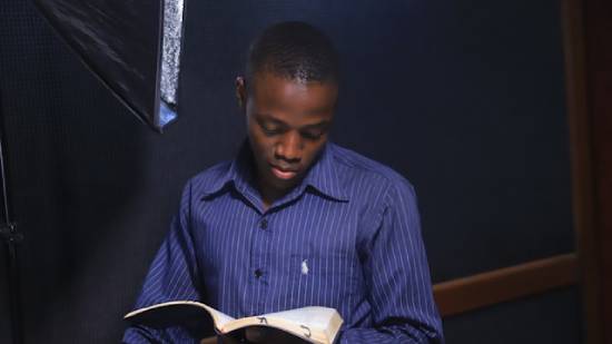 A man diligently studying the Bible to find clarity to help him shake off doubts.