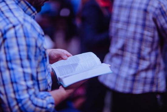 A Person Perusing Scriptures A person perusing scriptures to find examples of faithful biblical figures who struggled with doubts.