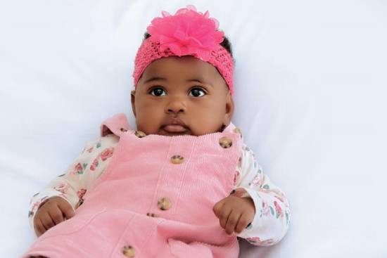 An Attentive Baby Girl An attentive baby girl keenly listening.