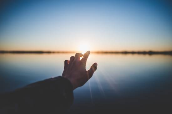 Hopeful Hand Hopeful hands pointing into the future, reassured that God is in control of the future.