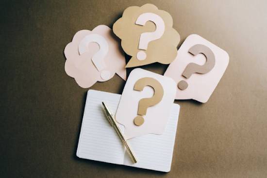 Question Marks on a Craft Paper Question marks on a craft paper signifying the difference between Godly planning and self-reliant control.