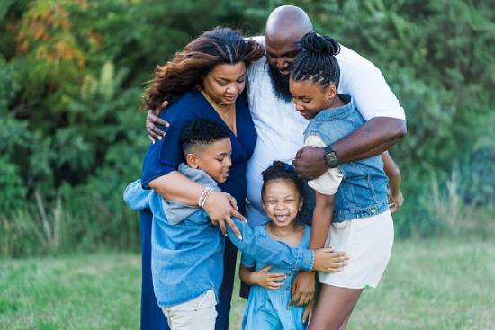 Family spending time together in the park to bond and learn how to care for each other.