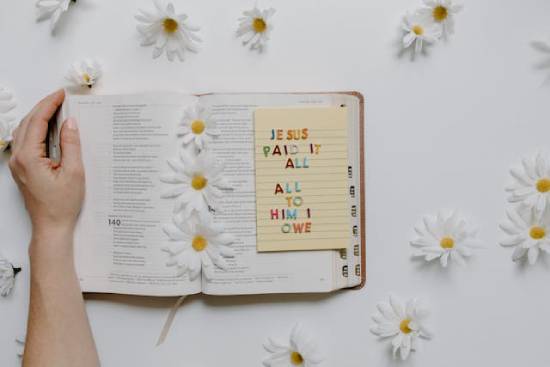 Open Bible with sticky notes and scripture affirming God's providence.