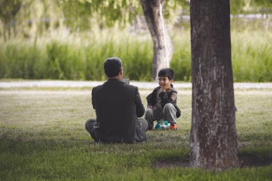 Father correcting his son constructively and with love to help him appreciate the biblical example of correcting in love.