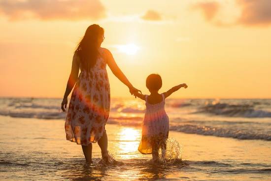 A mother and daughter spending time together at the beach to reconnect.