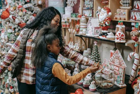 A mother and daughter shopping for souvenirs in a shopping mall.