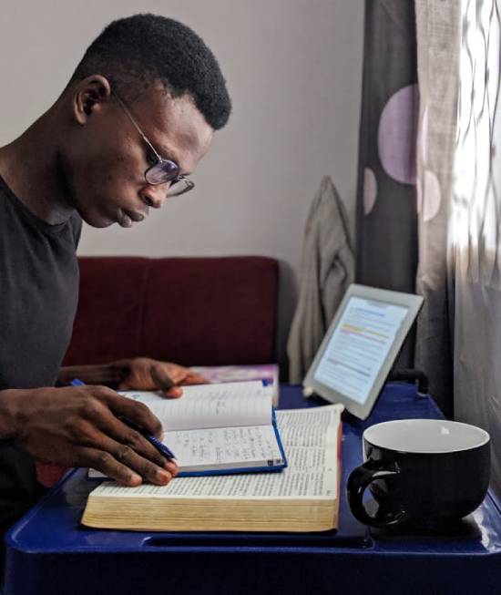 A man having a personal Bible study and making notes of important points.