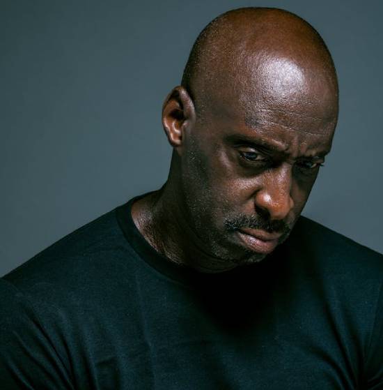 A Man With a Serious Look on the Face A disappointed man maintaining a serious facial expression.