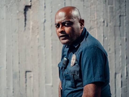 A Police Officer Looking Sideways A man in a police uniform looking sideways.