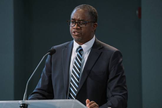 A pastor preaching a sermon on the role of faith and perseverance in discovering God’s plan.