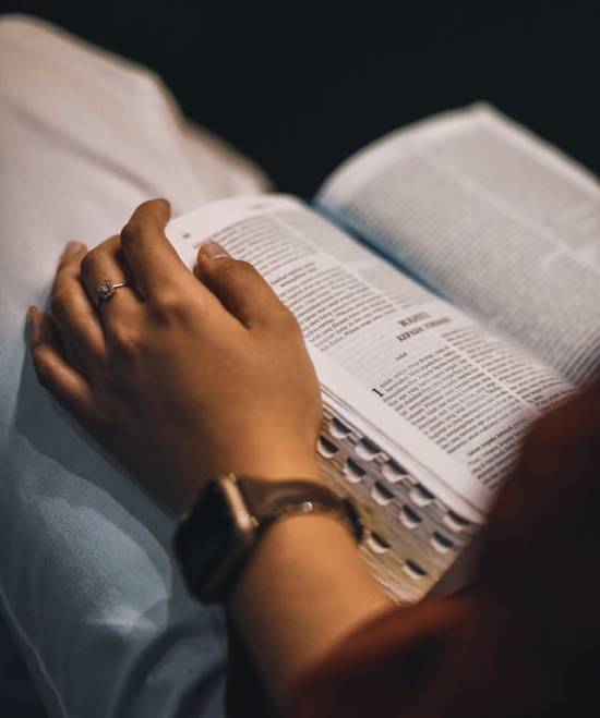 A Personal Bible Study A wooden block with inscription of the word 'faith' next to blue flowers.
