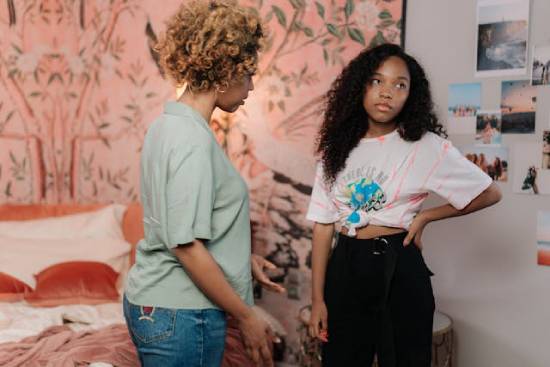 Mum Talking to a Bored Teenager A concerned mother trying to initiate a safe conversation with a bored teenage daughter.