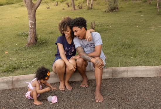 Family Time in the Garden A family spending time together in the garden on bare feet.