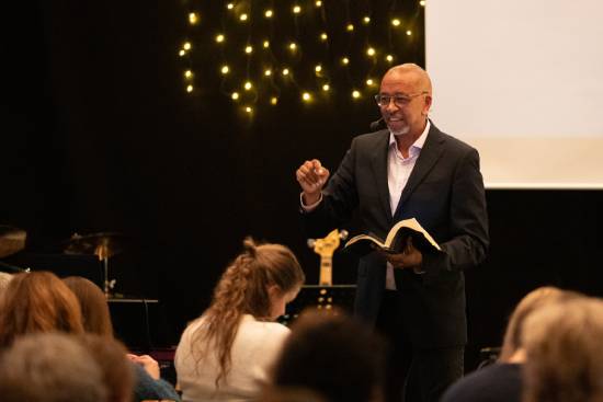A preacher leading a Bible study on disncipline and spiritual grounding.