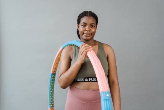 A fitness enthusiastic woman wearing sports bra and pants.