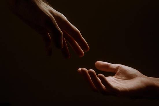Mutual efforts of two hands reaching to each other.