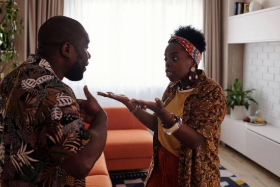 Couple Arguing A couple having an argument in the living room.