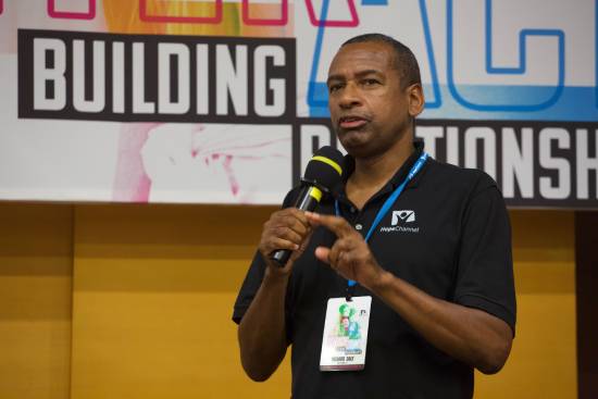 Talk on Building Relationships A faith leader delivering a talk on building relationships with God an dothers.