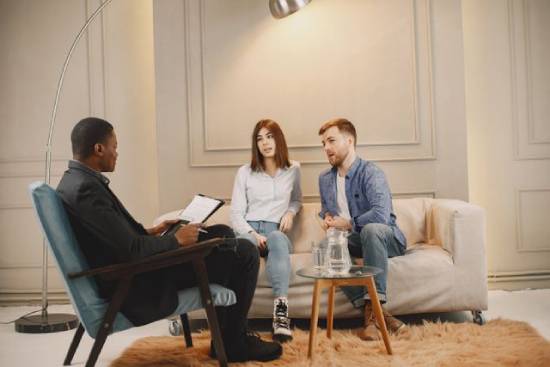 Couple Counseling Session A struggling couple seeking the support of a professional marriage counsellor.