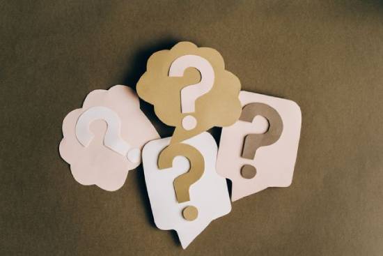 Questions Crafts A lot of question marks crafted on nicely cut pieces of paper.